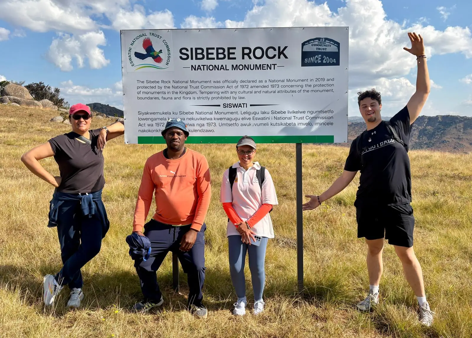 Students at the Sibebe Rock National Monument sign in Eswatini