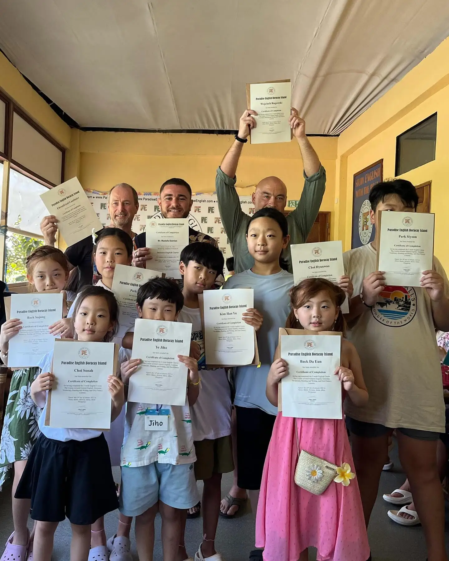 Junior camp students holding up their certificates