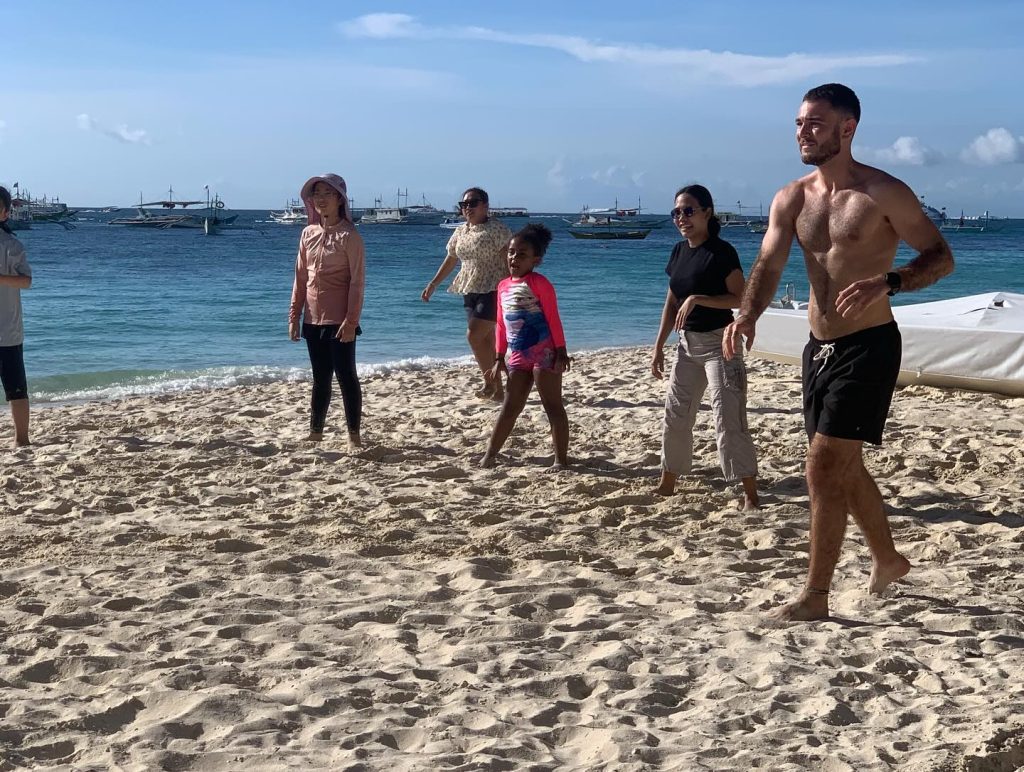 Students and teachers playing games on White Beach, Boracay